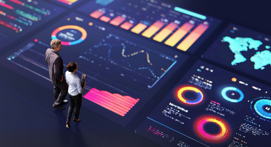 People analyzing digital financial data dashboards.